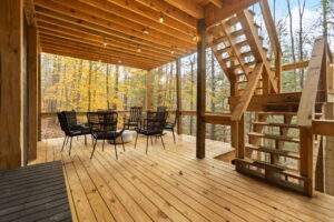 Wooden deck with furniture, showcasing our cabin construction in Red River Gorge, Kentucky.