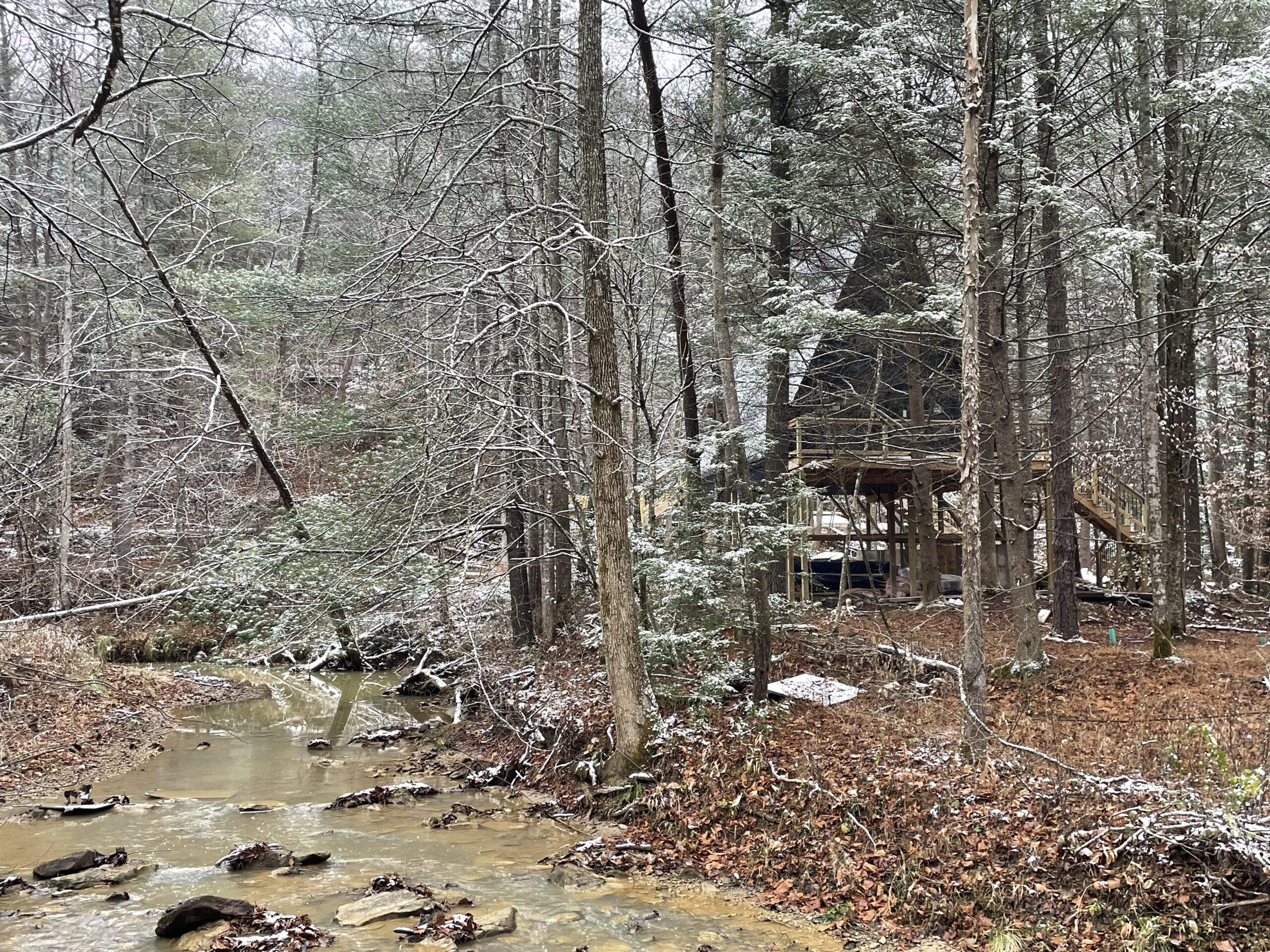 Land/Lots for Sale at the Red River Gorge KY 1 A-frame cabin nestled among snow-dusted trees in Red River Gorge, Kentucky, beside a creek. This custom-built cabin shows the beauty of creekfront living and our construction expertise.